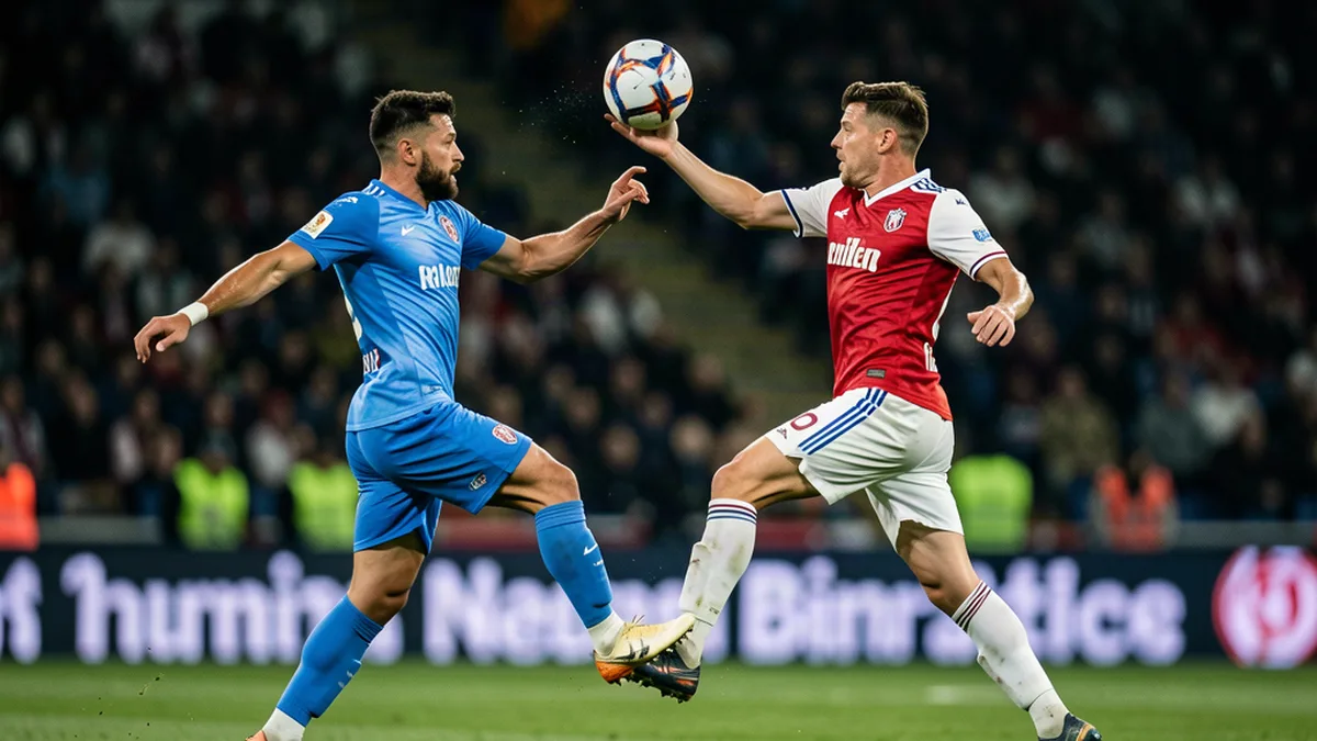 Duel aérien entre deux joueurs de Ligue 1 au milieu de terrain